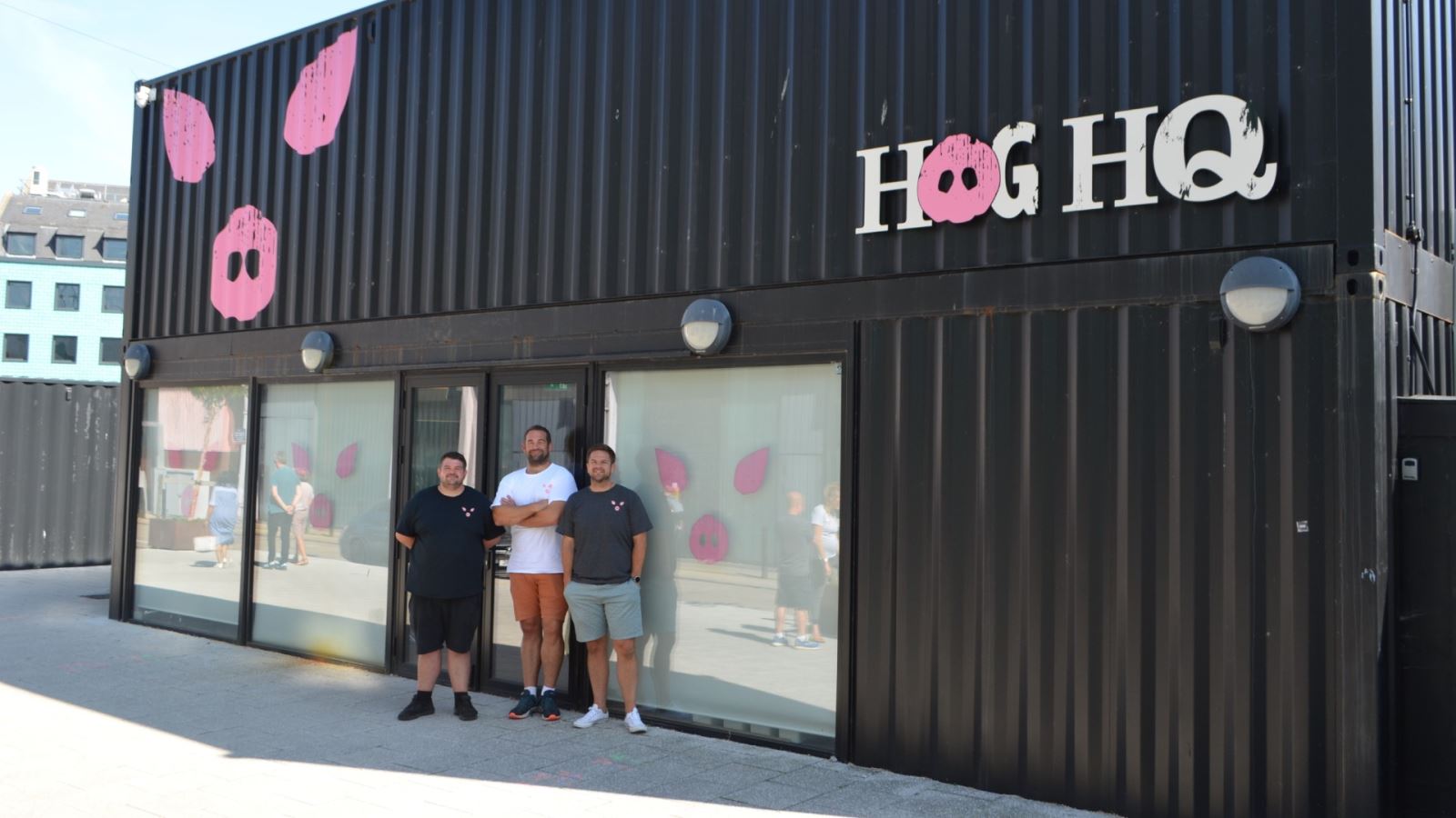 Josh, Olly and Max Kohn, brothers and founders of The Jolly Hog outside the new Hog HQ at Wapping Wharf